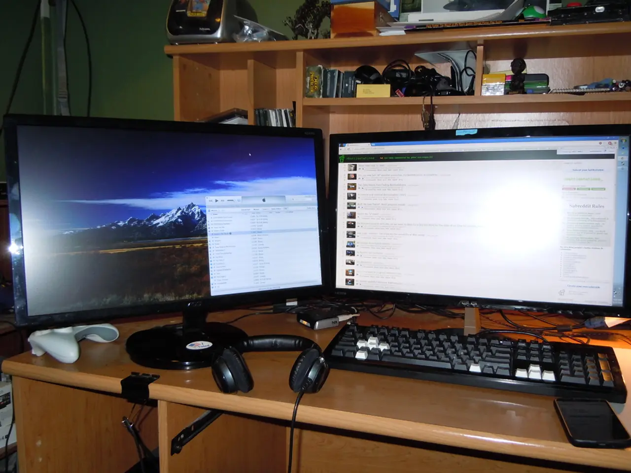Here there are two monitors,mobile,headset,cables,joystick and some other items on the table. In...