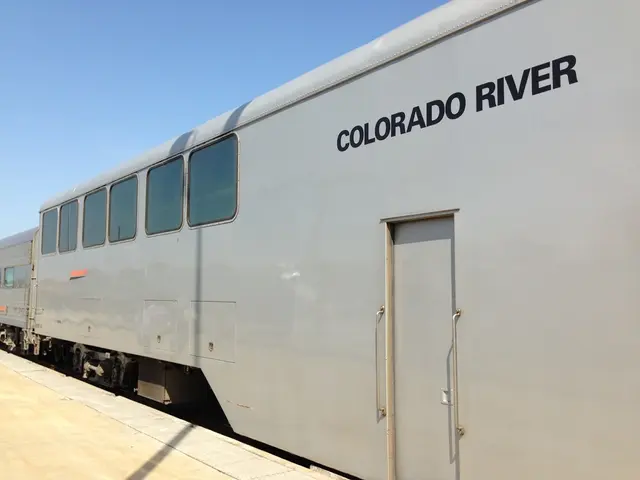 In this picture we can see a train, and we can find text on the train.