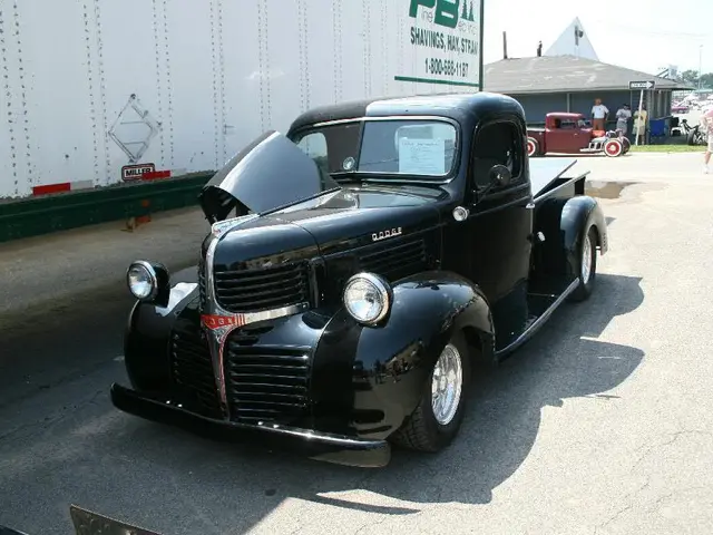 This picture is clicked outside. In the center we can see the vehicles, group of persons. On the...