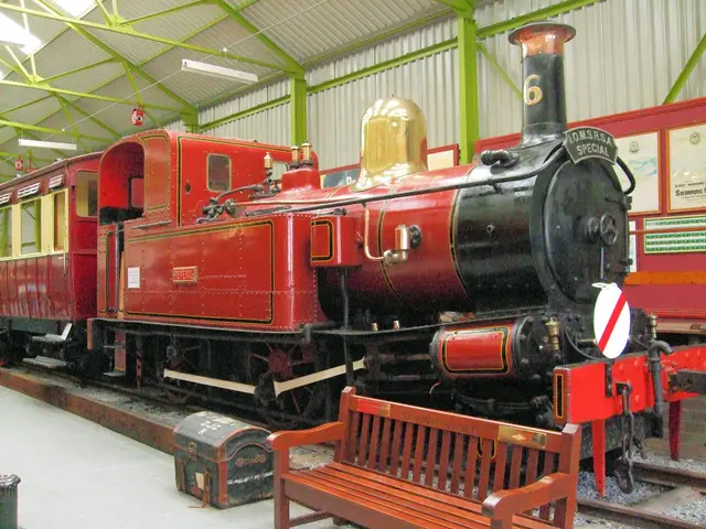 there is a red color train on which number 6 is written on the engine. in the front there is a...