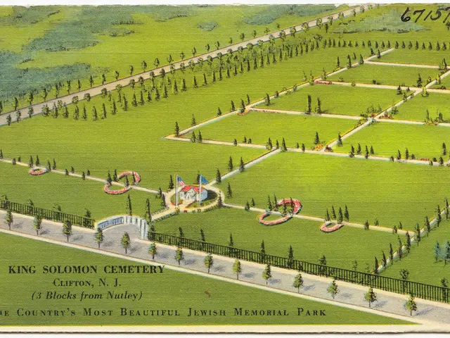 In this picture we can see a house, flags, trees, grass and fence. Something written on this...