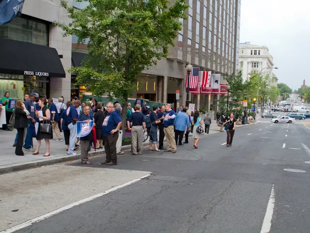 This is the picture of a place where we have some people and some vehicles on the road and around...